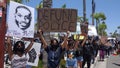 Oceanside, CA / USA - June 7, 2020: People hold signs during peaceful Black Lives Matter protest march Royalty Free Stock Photo