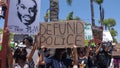 Oceanside, CA / USA - June 7, 2020: People hold signs during peaceful Black Lives Matter protest march