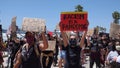 Oceanside, CA / USA - June 7, 2020: People hold signs during peaceful Black Lives Matter protest march Royalty Free Stock Photo