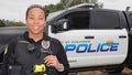 Oceanside, CA / USA - October 27, 2019: A friendly young female police officer of mixed ethnicity Royalty Free Stock Photo