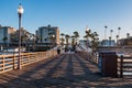 A Man Begins to Walk Down Oceanside Pier in the Morning Royalty Free Stock Photo