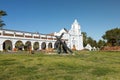 Wide view of front lawn at Mission San Luis Rey with religious statues