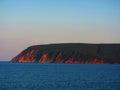 Oceanside cliffs at sunset Ingonish Beach Nova Scotia Royalty Free Stock Photo