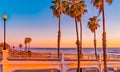 Oceanside Pier is glowing from the rosy sunset light in Oceanside, California Royalty Free Stock Photo