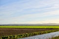 Oceanside walk long grass road stream fields clouds sunshine fields green agriculture fence mowing