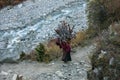 Ocotber 9, 2013, women carry dry wood to their homes in highland