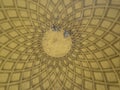Ocre round ceiling with rafters forming a pattern