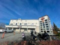 Row of motorcycles at entrance of large Harley-Davidson dealers in Anchorage