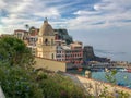 Foliage and church tower dominate this hillside view of Vernazza, Italy, on a sunny October day