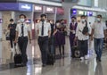 Flight attendant walks past at the departure hall in Hong Kong international airport
