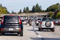 Oct 18, 2019 Oakland / CA / USA - Heavy traffic on one of the freeways East San Francisco Bay Area; motorcyclist splitting lanes Royalty Free Stock Photo