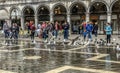 Gulls and people in a flooded Piazza San Marco, Venice, Italy