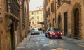 Red mini parked on a Florentine street, Italy