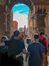 Tourists follow guide into Colosseum in Rome