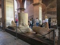 Tourists stroll past explanatory panels into the Roman Colosseum