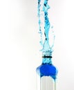 Octagon shaped glass bottle with water frozen with high speed flash photography