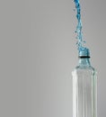 Octagon shaped glass bottle with water frozen with high speed flash photography