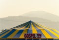 October 2022 - Abbotsford, Canada: A tent erected for nightly Christian gospel services sits in a farm field.