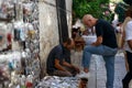 04 October 2022. Antalya, Turkey. On the street, a man cleans sneakers for a passerby.