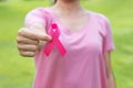 October Breast Cancer Awareness month, adult Woman in pink T- shirt with hand holding Pink Ribbon for supporting people living and Royalty Free Stock Photo