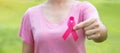 October Breast Cancer Awareness month, adult Woman in pink T- shirt with hand holding Pink Ribbon for supporting people living and Royalty Free Stock Photo