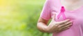 October Breast Cancer Awareness month, adult Woman in pink T- shirt and Pink Ribbon for supporting people living and illness. Royalty Free Stock Photo