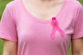 October Breast Cancer Awareness month, adult Woman in pink T- shirt and Pink Ribbon for supporting people living and illness.