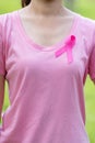 October Breast Cancer Awareness month, adult Woman in pink T- shirt and Pink Ribbon for supporting people living and illness. Royalty Free Stock Photo