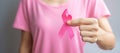 October Breast Cancer Awareness month, elderly Woman in pink T- shirt with hand holding Pink Ribbon for supporting people living Royalty Free Stock Photo