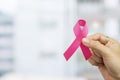 October Breast Cancer Awareness month, Woman holding Pink Ribbon for supporting people living and illness. Healthcare, Royalty Free Stock Photo