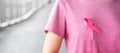 October Breast Cancer Awareness month, Woman in pink T- shirt with Pink Ribbon for supporting people living and illness. Royalty Free Stock Photo