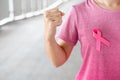 October Breast Cancer Awareness month, Woman in pink T- shirt with Pink Ribbon for supporting people living and illness.