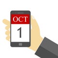 1 October - Businessman holding mobile phone with 1 Oct SMS