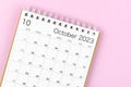 A October 2023 calendar desk for the organizer to plan and reminder isolated on pink background Royalty Free Stock Photo