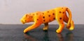 October, 2019, Close-up of figure of a toy Cheetah, Mumbai, India, Close-up of figure of a toy Cheetah on a grey background,