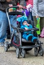 October 27, 2018 Coloma MI USA; a cute little baby in a blue dinosaur costume enjoys being pushed in his stroller at an outdoor