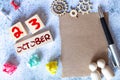 October 23 - Daily colorful Calendar with Block Notes and Pencil on wood table background,