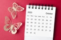 A October 2023 desk calendar for the organizer to plan and reminder with paer butterfly on red background Royalty Free Stock Photo