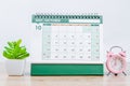 October 2021 Desk calendar with pink alarm clock Royalty Free Stock Photo