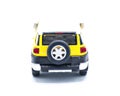 October 10, 2023 diecast car Toyota FJ Cruiser Collectible toy model isolated on a white background yellow sun fire or sun fire