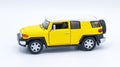 October 10, 2023 diecast car Toyota FJ Cruiser Collectible toy model isolated on a white background yellow sun fire or sun fire