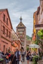 Tourists wander the streets of charming village of Eguisheim,France. Royalty Free Stock Photo