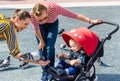 BARCELONA, CATALONIA, SPAIN - October 11, 2018 : A young woman shows a boy a pigeon and offers kid to feed a bird.