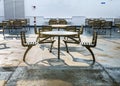 October 5, 2019 - Howe Sound, BC: Metal wheelchair accessible covered outdoor seats and tables on a BC Ferries ship. Royalty Free Stock Photo