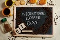 1 October International coffe day words on blackboard flat lay