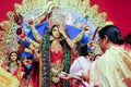 october, 2018, Kolkata, India. Bengali women greeting idol of godess durga with sweets and betel leaves in a very important ritual