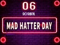 06 October, Mad Hatter Day, Neon Text Effect on Bricks Background Royalty Free Stock Photo