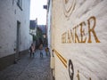 October 2018 - Mechelen, Belgium: Narrow alley leading to the old original entrance of the brewery Het Anker in the beguinage Royalty Free Stock Photo