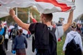 October 4 2020 Minsk Belarus A man holds an opposition flag above him in protest