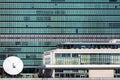 OCTOBER 24, 2016 - NEW YORK - Close up of United Nations Building windows and satellite dish from East River, New York
